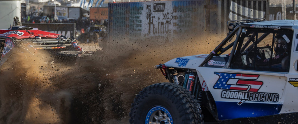 Ultra4 race cars side by side in the dust at King of the Hammers. Gearshift Garage Live Stream Racing devices collection.
